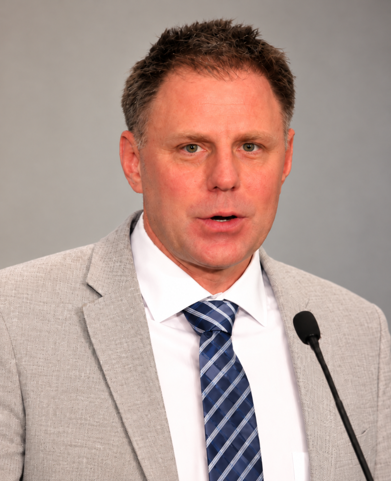 An image of Jeff Pitts speaking at a press conference